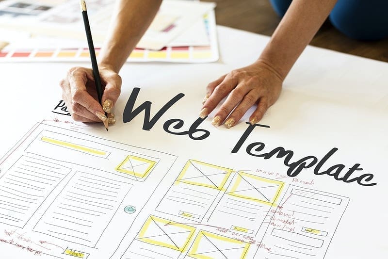 hoa website template - picture of a person writing web template