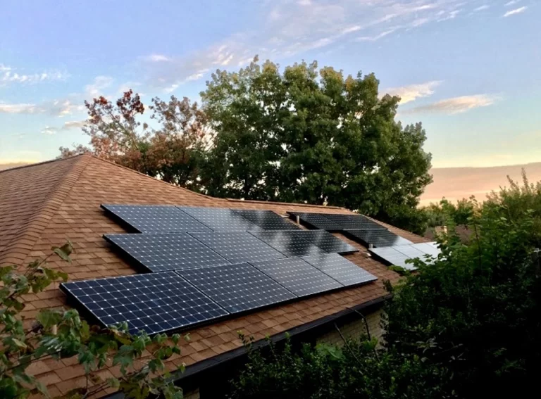HOA solar panels on residential home, exemplifying sustainable energy solutions for homeowners' associations (HOAs)