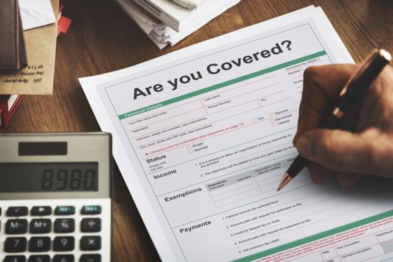 Person filling out a form for an HOA insurance in Florida, ensuring comprehensive coverage and protection for the community