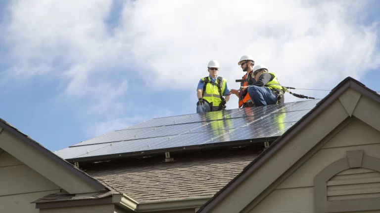 2 contractors working on a hoa roof replacement