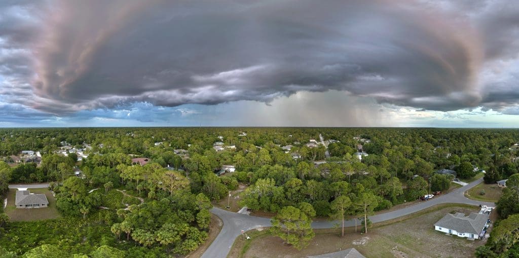 storm clouds over suburban neighborhood with lush 2026 03 16 02 07 36 utc